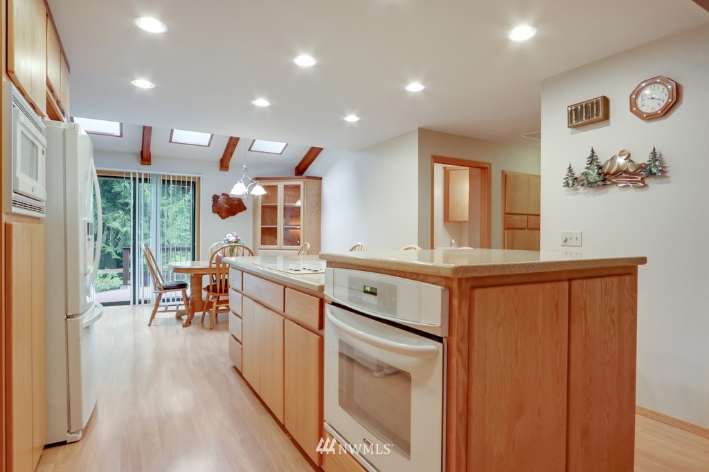 25308 Brooks Road East Orting, WA 98360 - Photo 22 of 40 a kitchen with stainless steel appliances granite countertop sink stove and cabinets