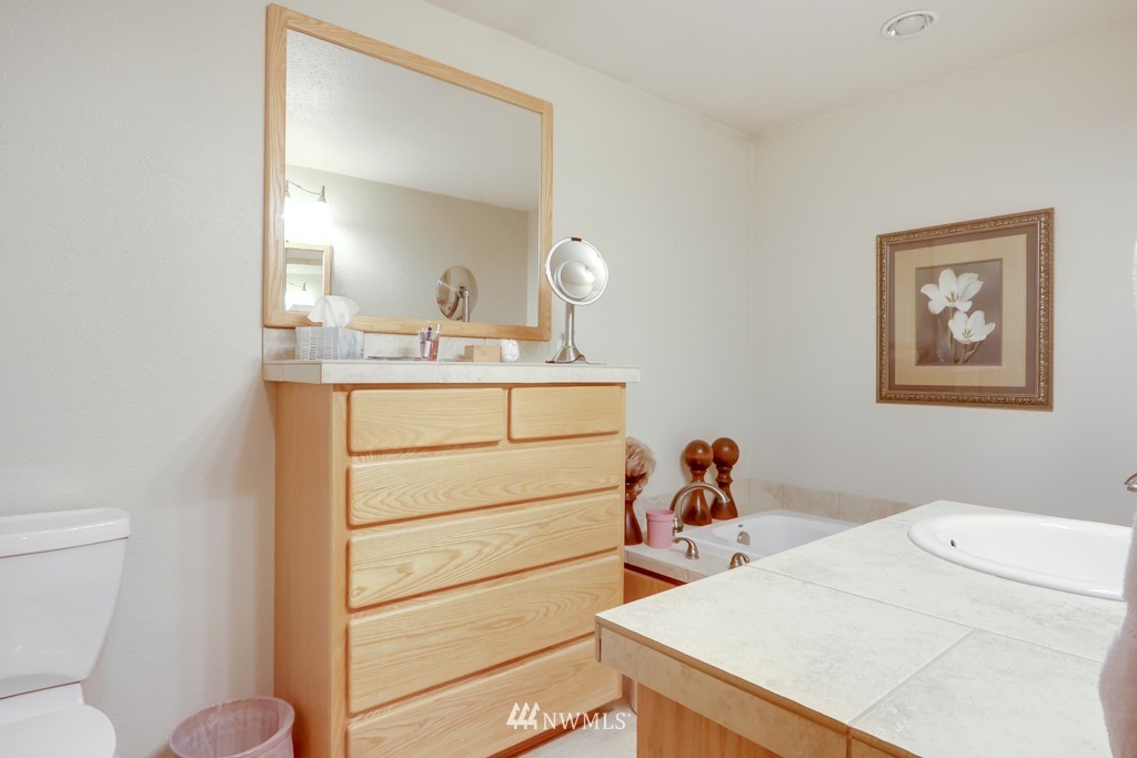 25308 Brooks Road East Orting, WA 98360 - Photo 28 of 40 a bedroom with a bed and a dresser