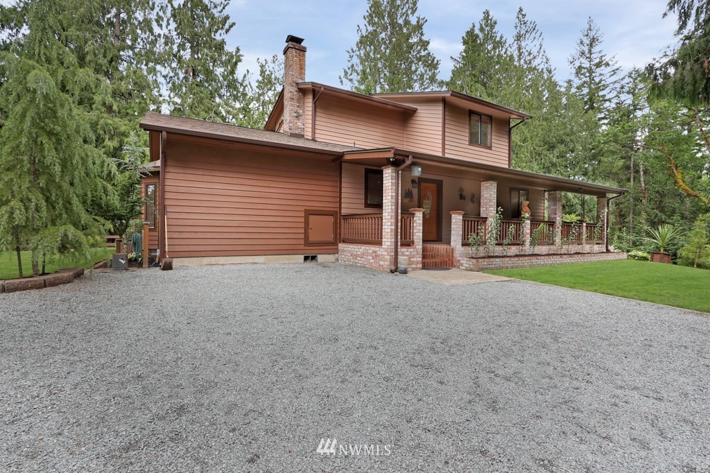 25308 Brooks Road East Orting, WA 98360 - Photo 4 of 40 a view of a house with a yard and large tree