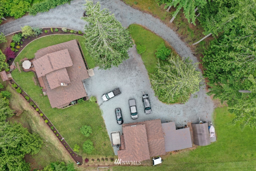 25308 Brooks Road East Orting, WA 98360 - Photo 34 of 40 an aerial view of a house with a yard and greenery