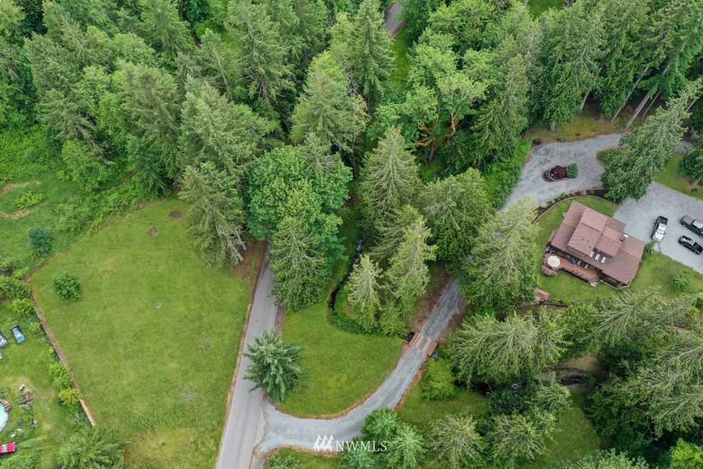 25308 Brooks Road East Orting, WA 98360 - Photo 37 of 40 an aerial view of residential house with outdoor space and trees all around