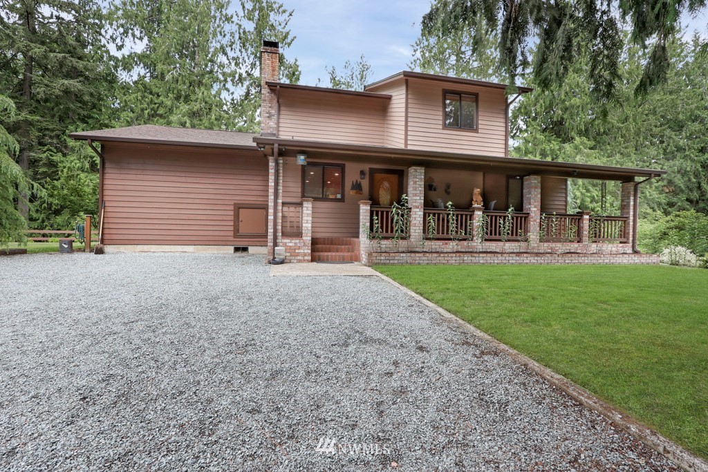 25308 Brooks Road East Orting, WA 98360 - Photo 10 of 40 a front view of a house with garden