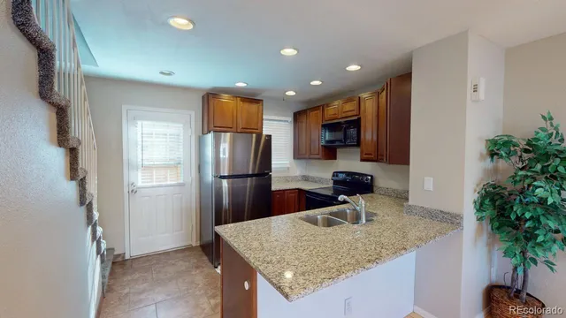 a view of a kitchen from a hallway