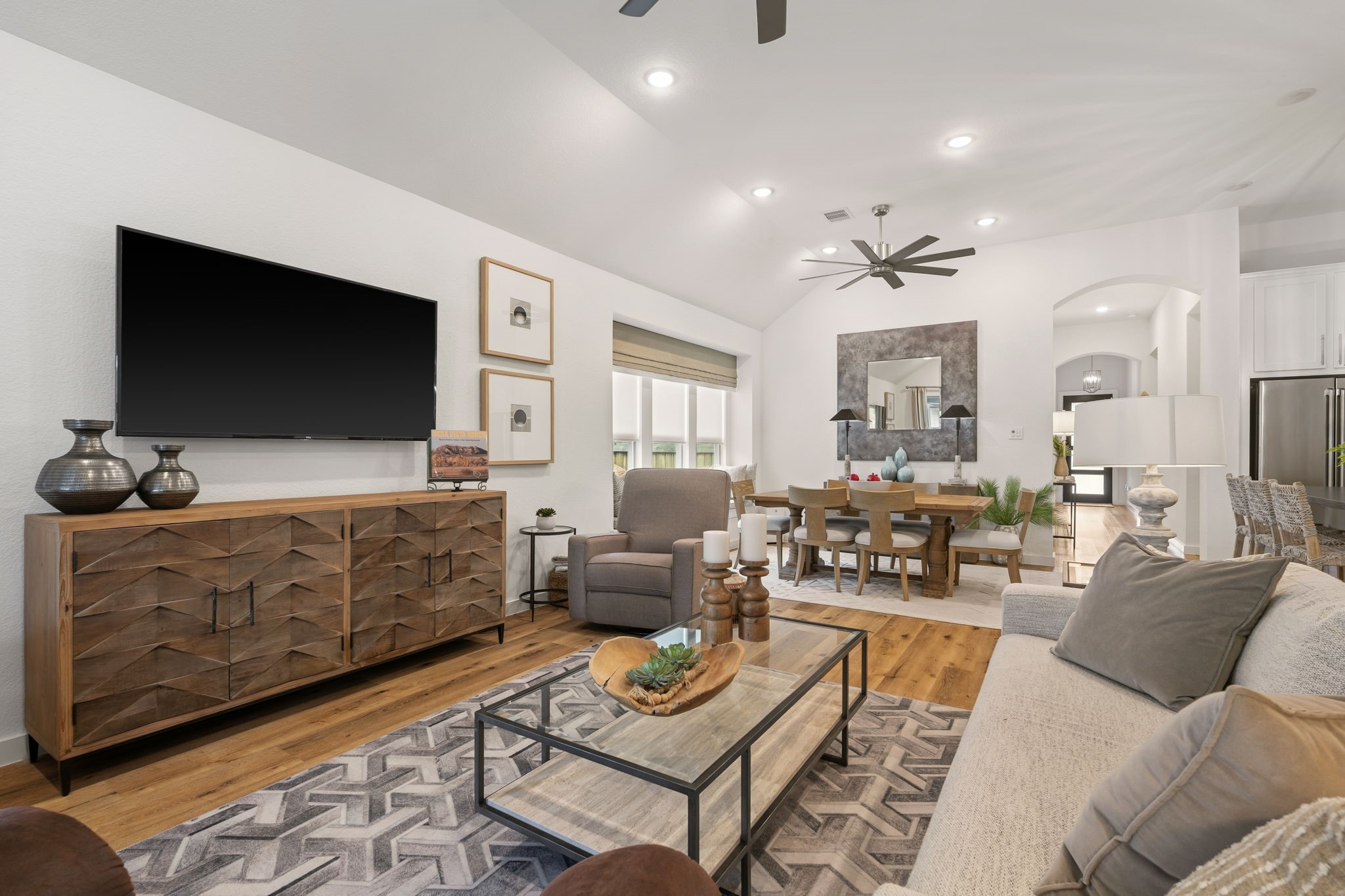 8113 Triumph Bend Way Magnolia, TX 77354 - Photo 13 of 33 a living room with furniture and a flat screen tv