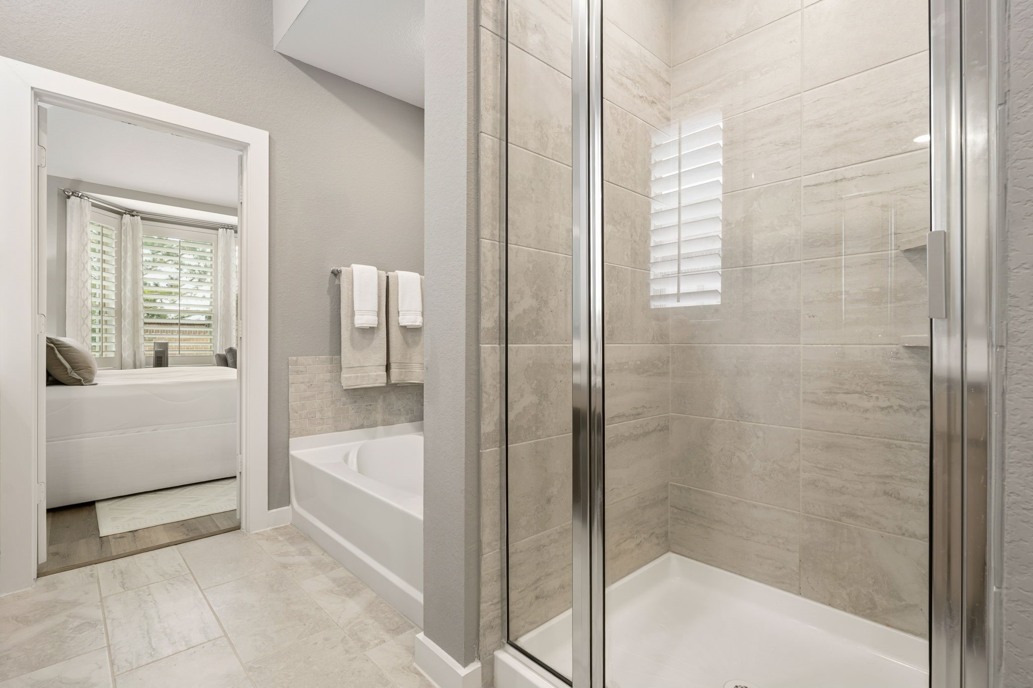 8113 Triumph Bend Way Magnolia, TX 77354 - Photo 19 of 33 a bathroom with a bathtub and a shower