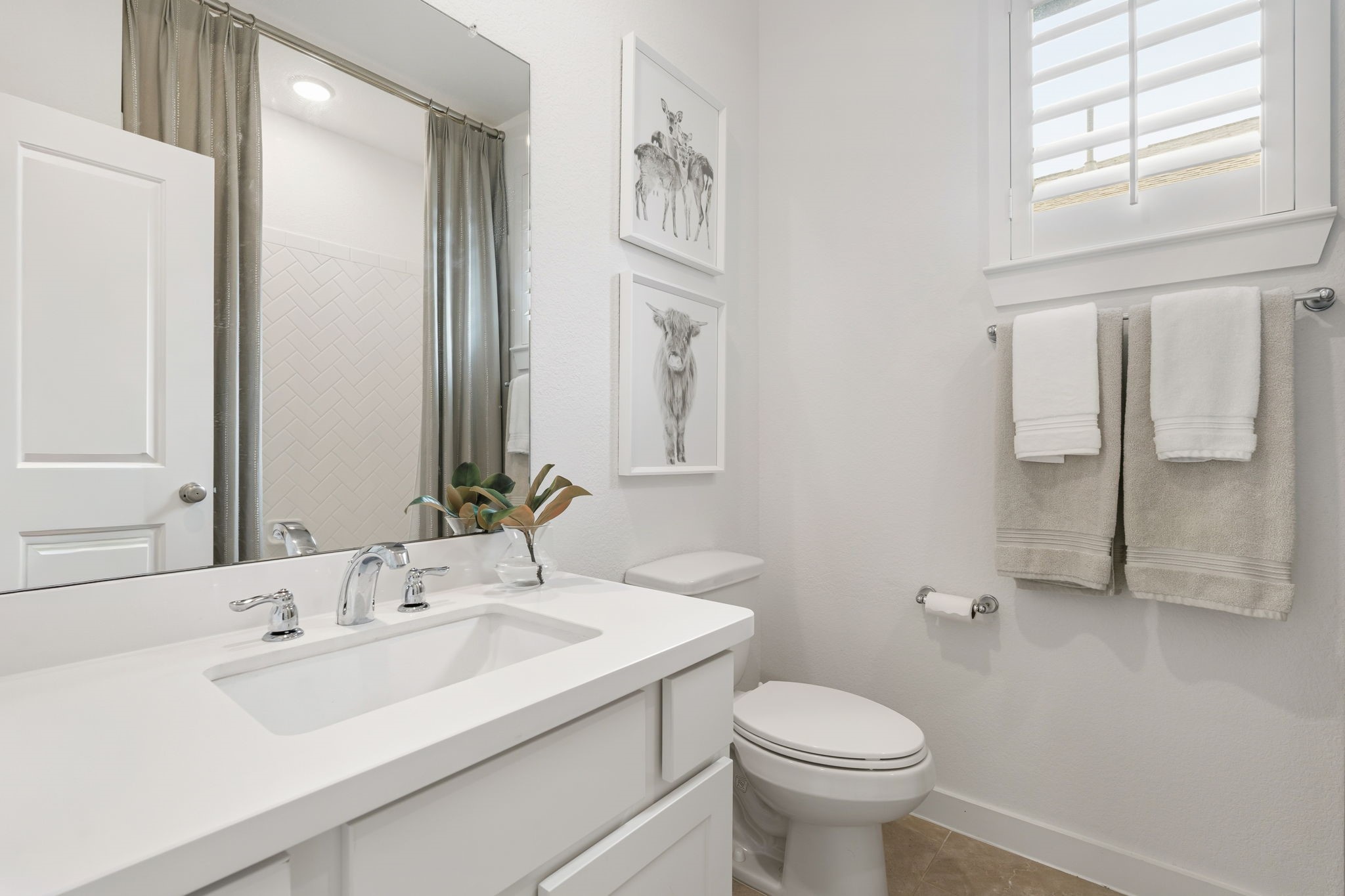 8113 Triumph Bend Way Magnolia, TX 77354 - Photo 25 of 33 a bathroom with a sink toilet and a mirror