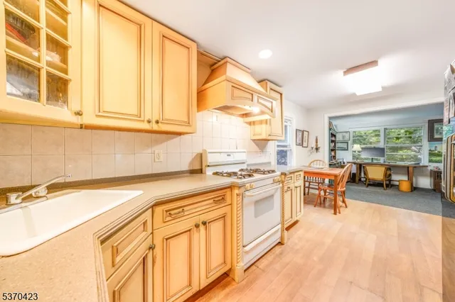 a kitchen with stainless steel appliances granite countertop a sink and cabinets