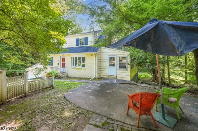 a backyard of a house with seating space
