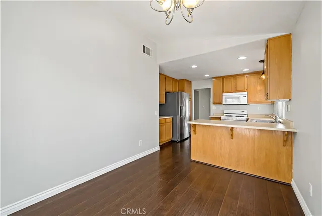 a view of kitchen with wooden floor