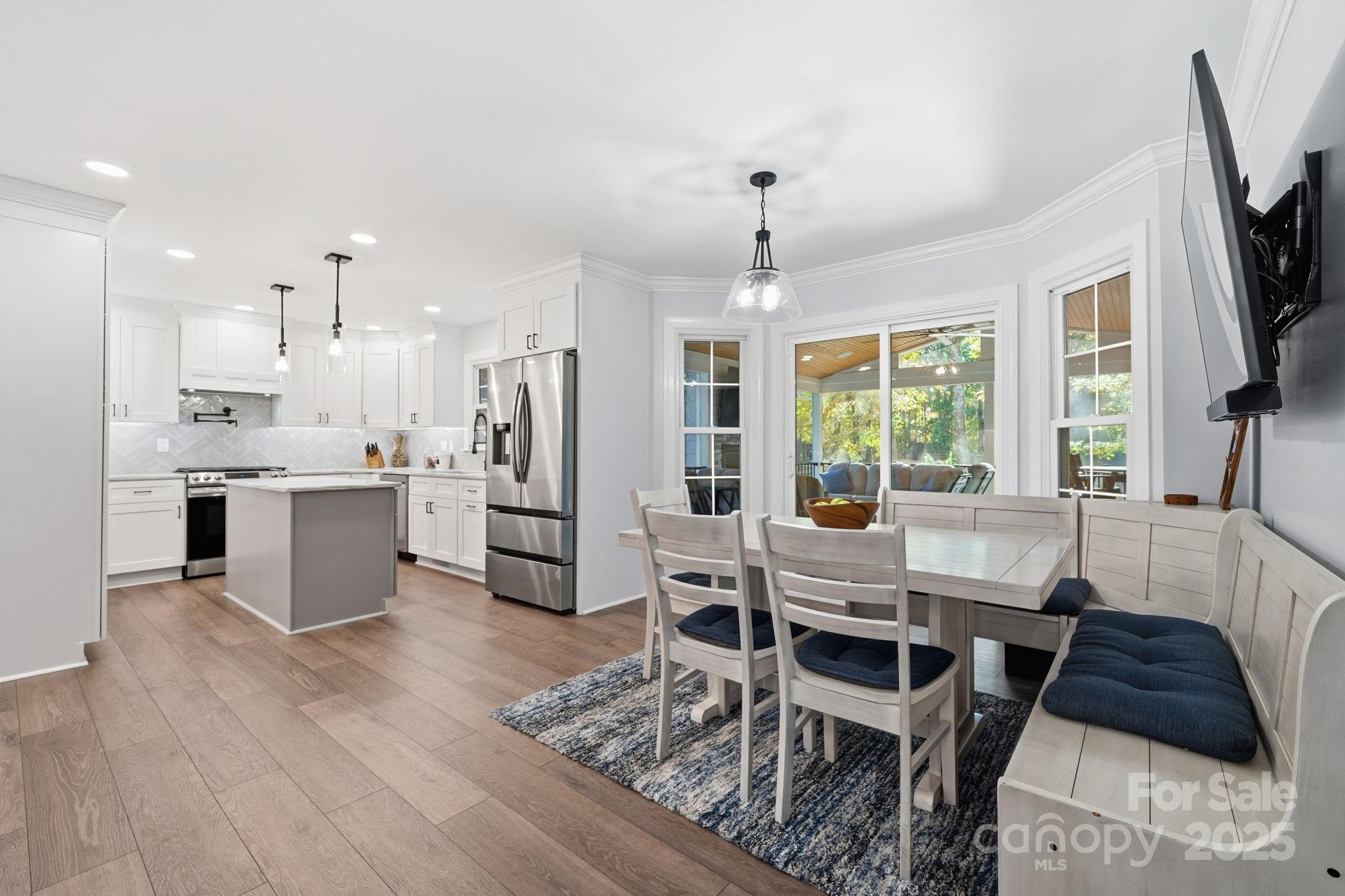 6600 Shaftesbury Road Charlotte, NC 28270 - Photo 16 of 42 a view of a dining room with furniture window and wooden floor