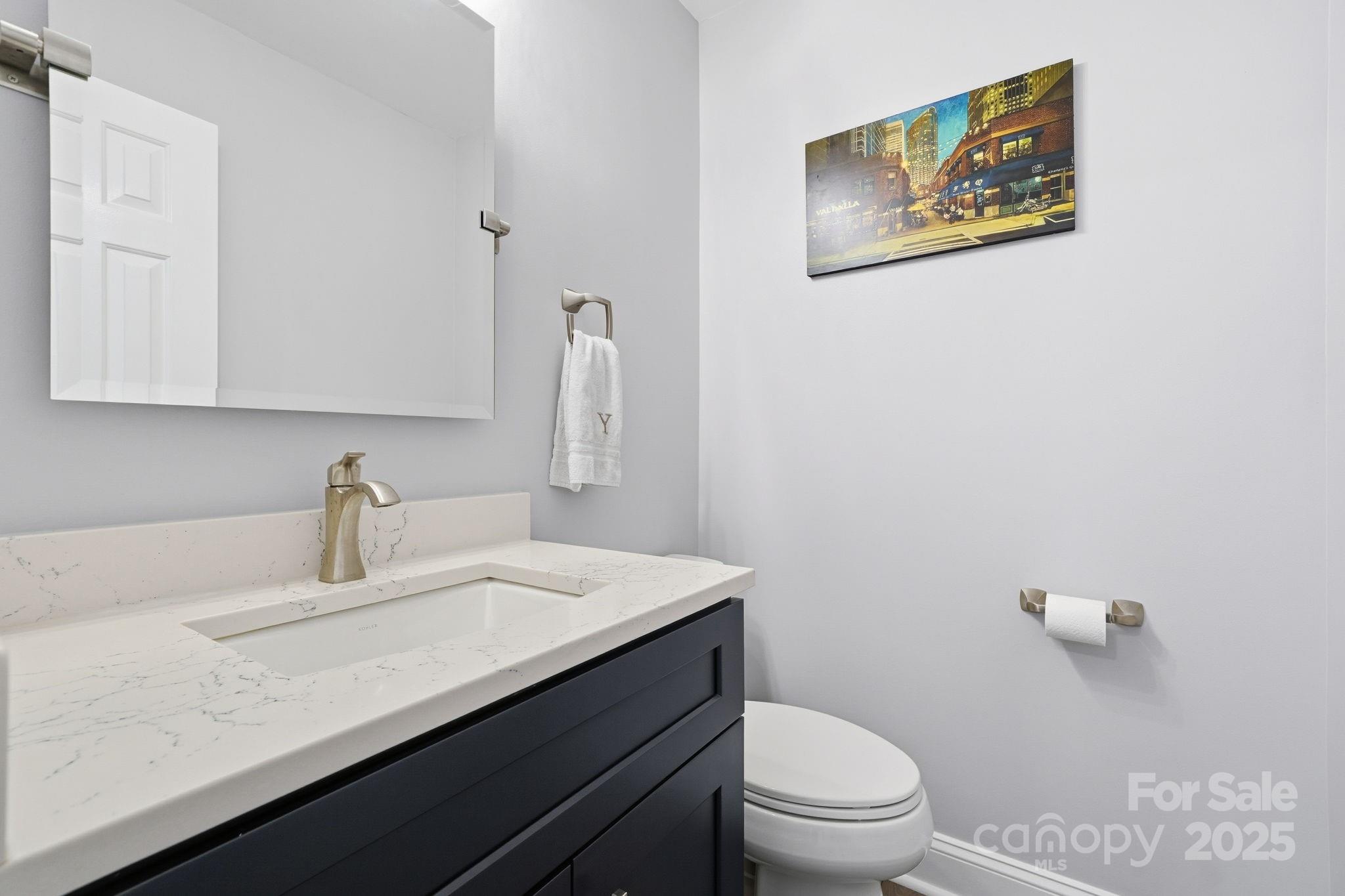6600 Shaftesbury Road Charlotte, NC 28270 - Photo 21 of 42 a bathroom with a granite countertop sink mirror vanity and toilet