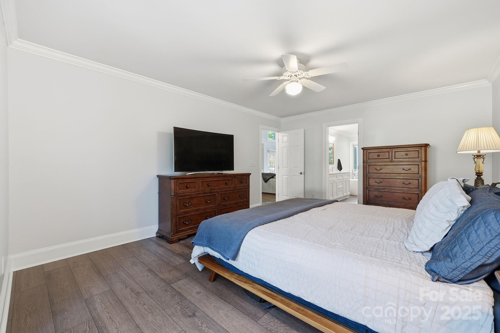 6600 Shaftesbury Road Charlotte, NC 28270 - Photo 24 of 42 a bedroom with a bed and a flat screen tv
