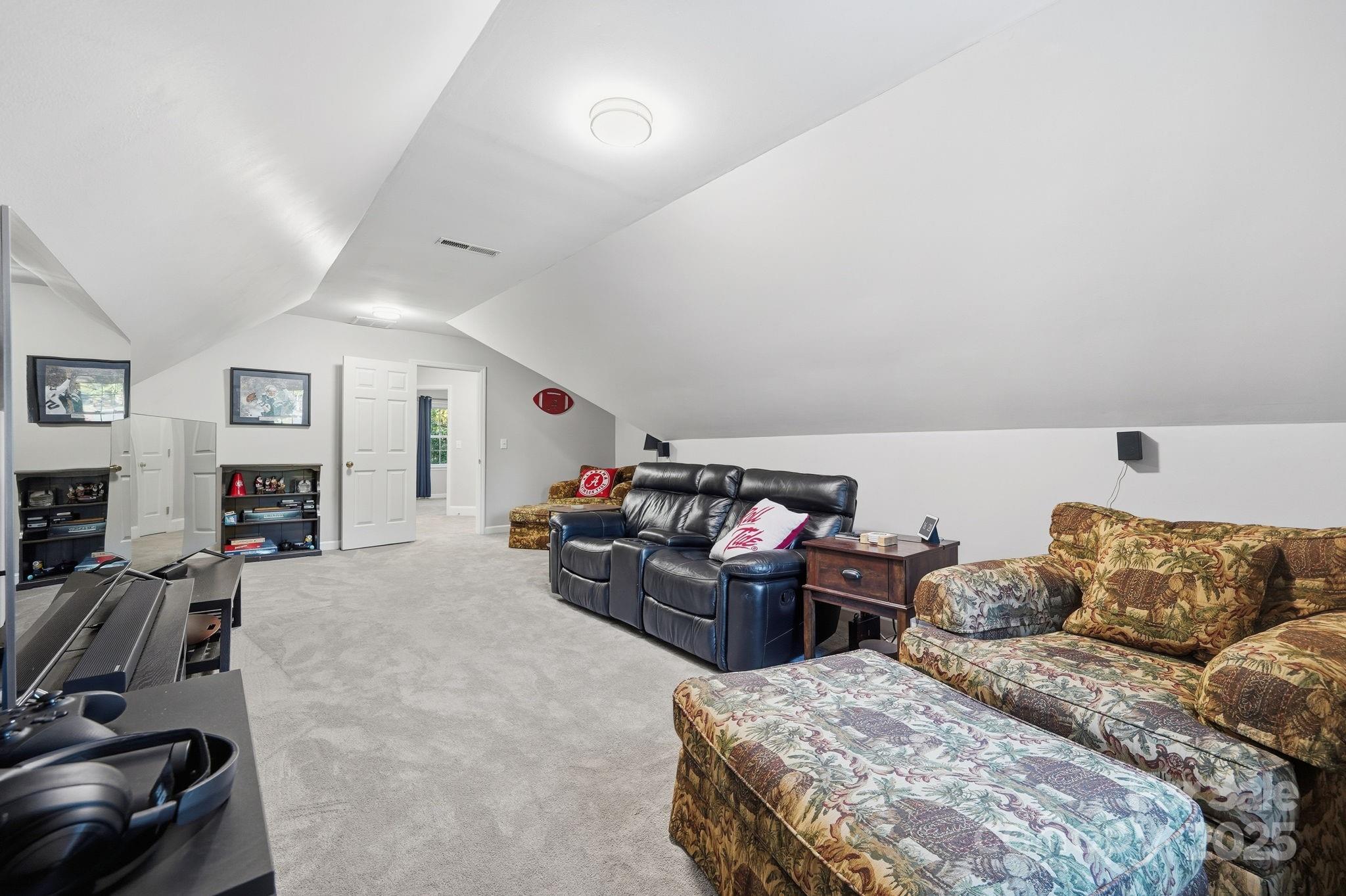 6600 Shaftesbury Road Charlotte, NC 28270 - Photo 28 of 42 a living room with furniture a couch and a flat screen tv
