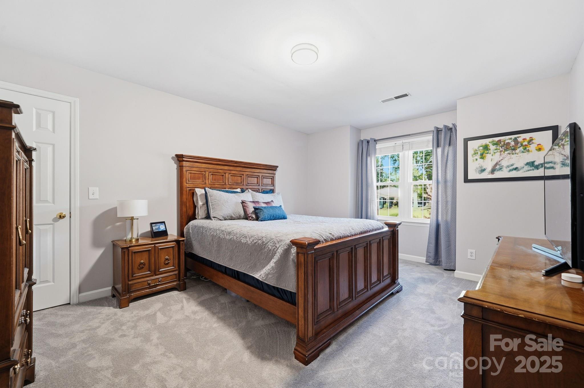 6600 Shaftesbury Road Charlotte, NC 28270 - Photo 30 of 42 a bedroom with a bed and a window