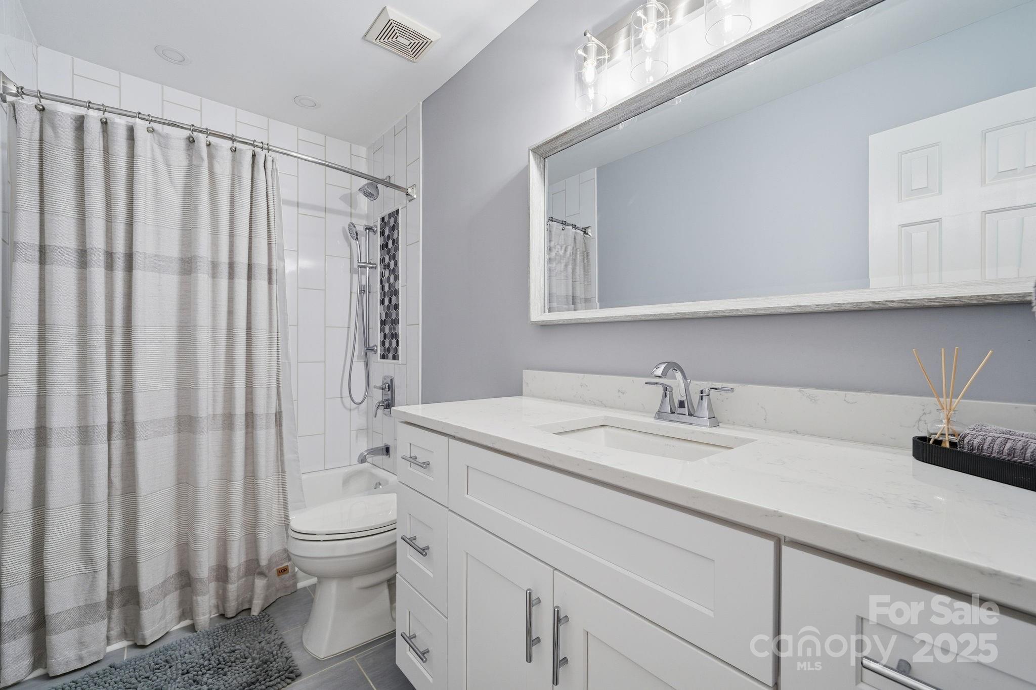 6600 Shaftesbury Road Charlotte, NC 28270 - Photo 31 of 42 a bathroom with a granite countertop sink and a mirror