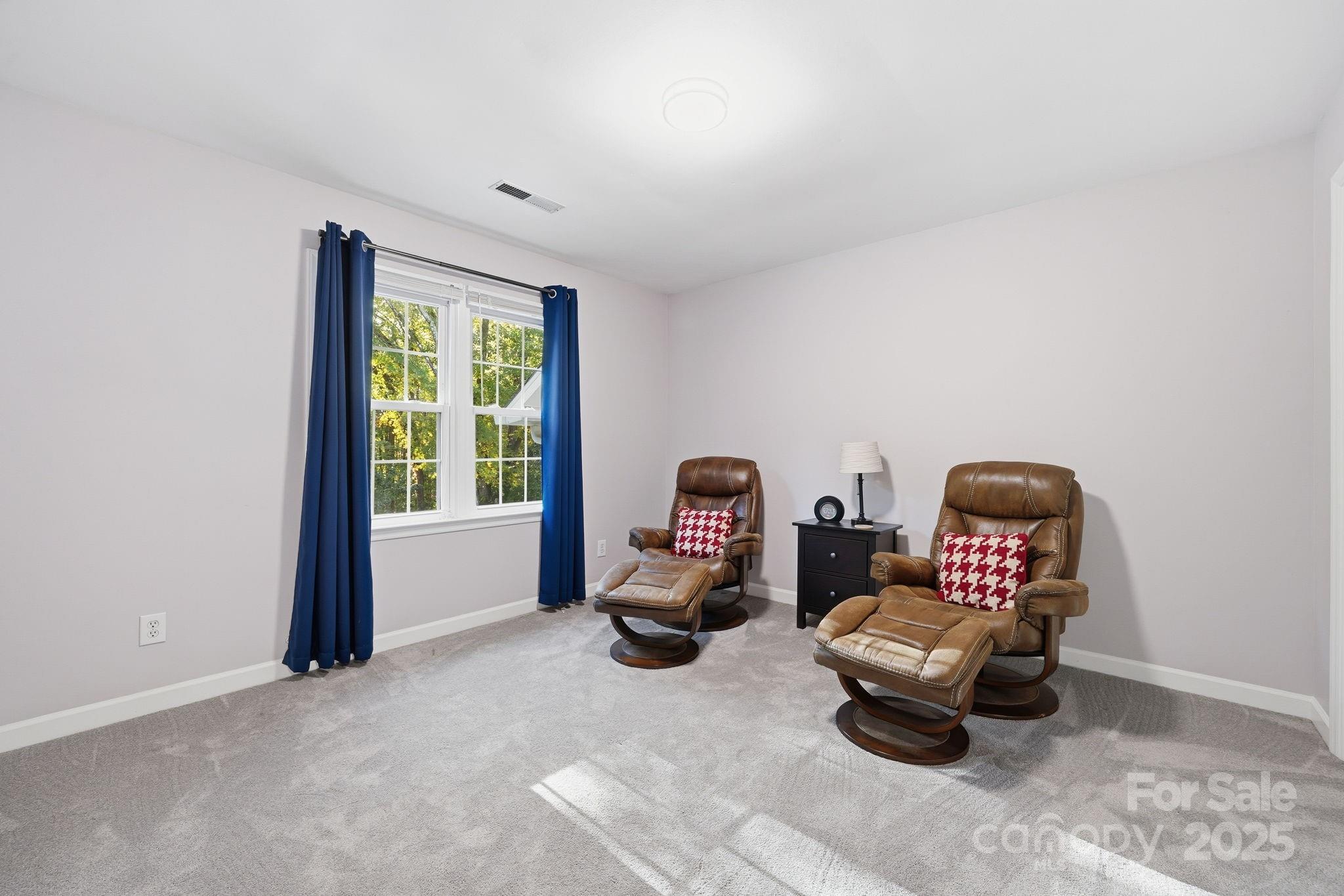 6600 Shaftesbury Road Charlotte, NC 28270 - Photo 32 of 42 a living room with furniture and a window