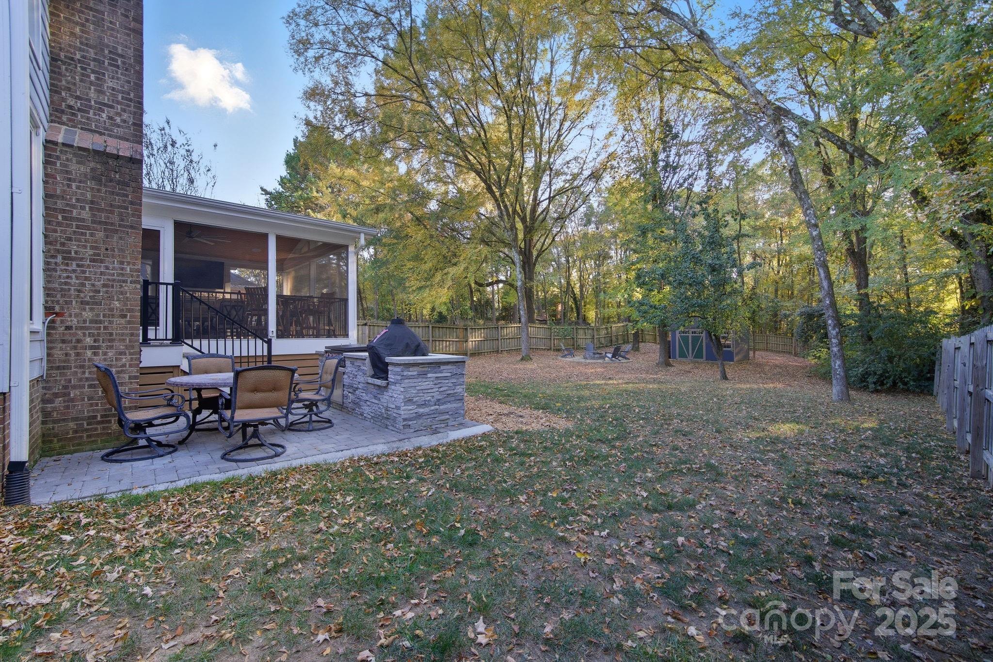 6600 Shaftesbury Road Charlotte, NC 28270 - Photo 36 of 42 a view of a backyard with sitting area