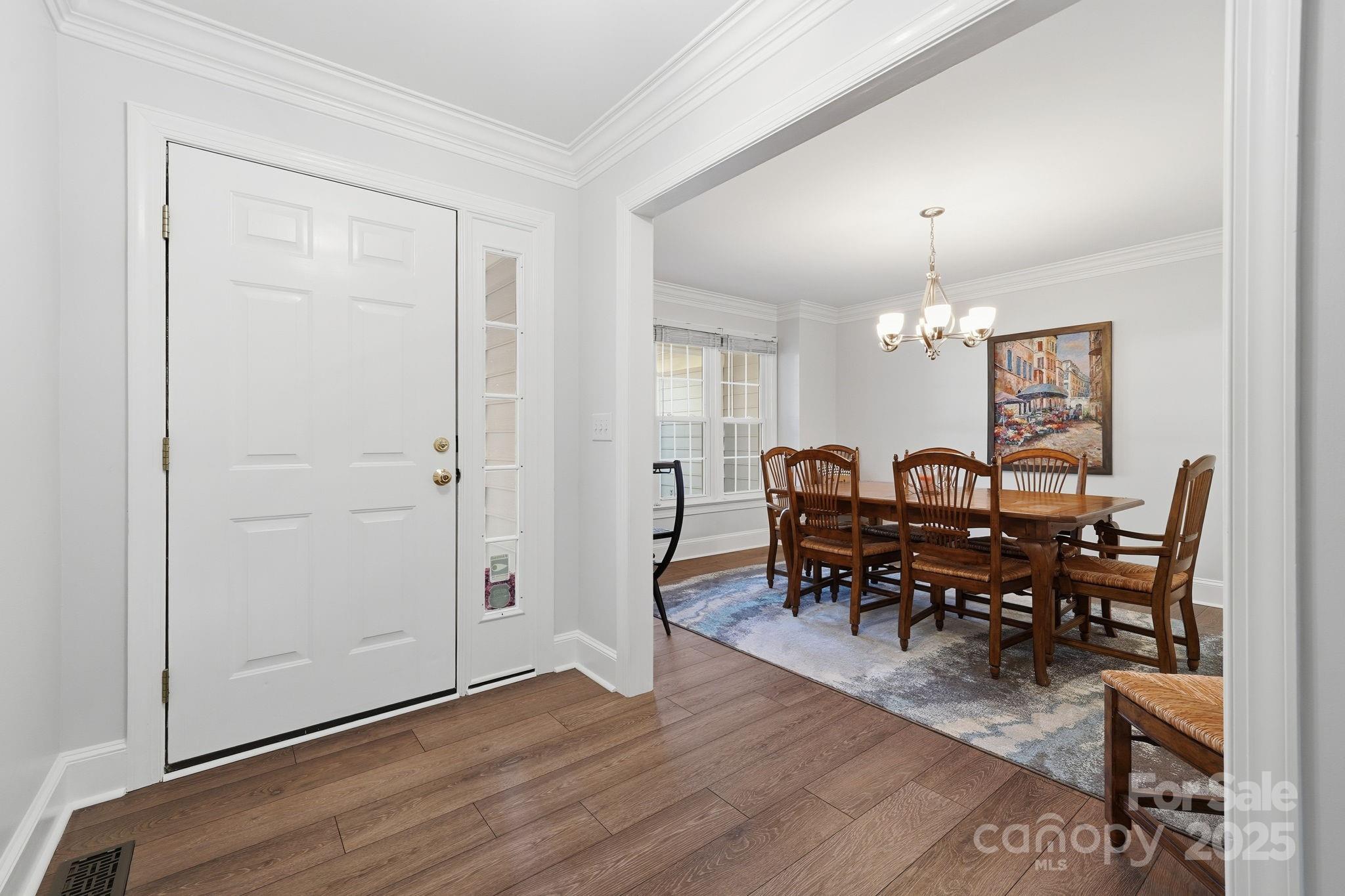 6600 Shaftesbury Road Charlotte, NC 28270 - Photo 4 of 42 a view of a dining room with furniture and chandelier