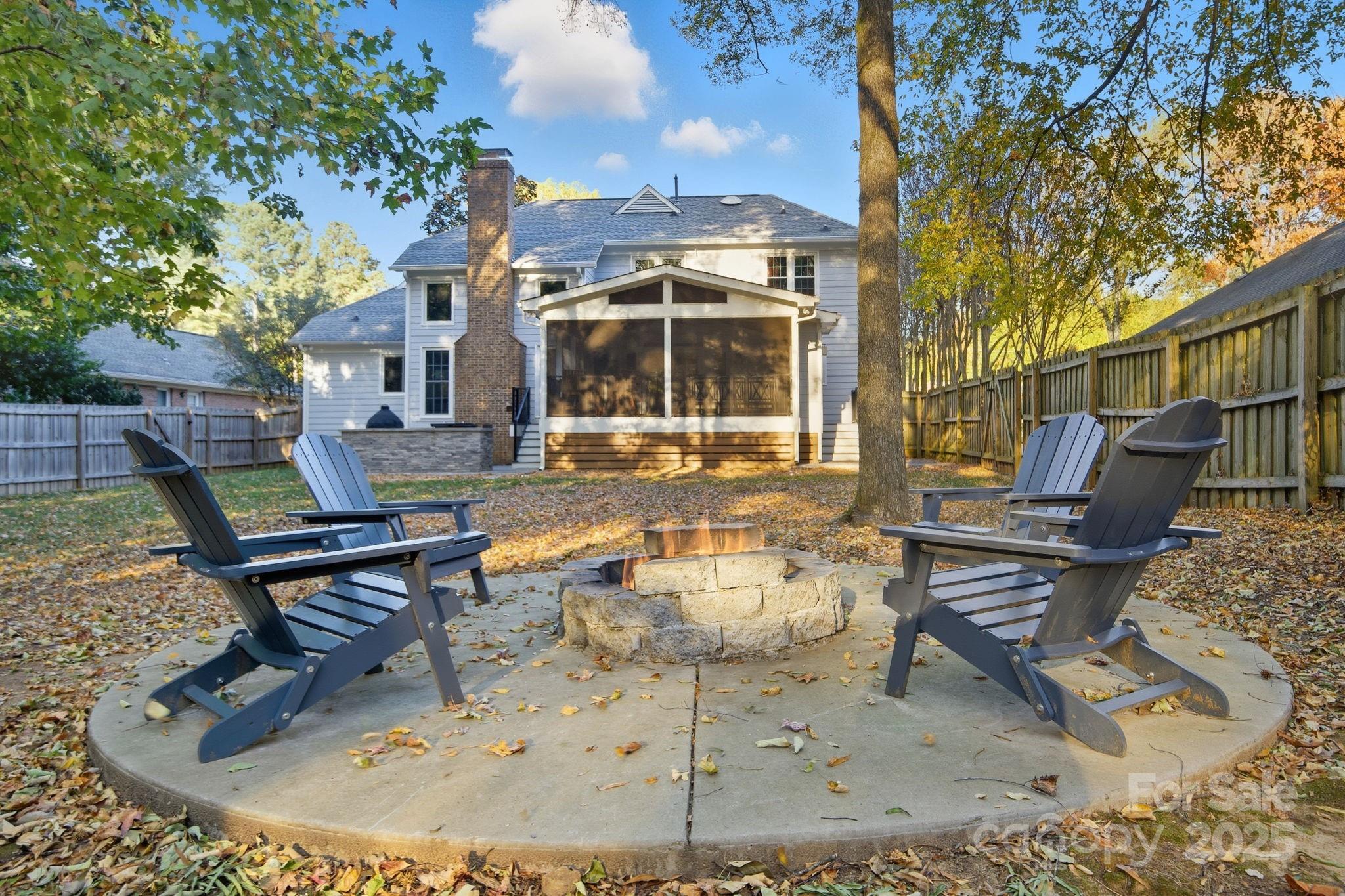 6600 Shaftesbury Road Charlotte, NC 28270 - Photo 41 of 42 a view of a house with backyard water fountain and sitting area
