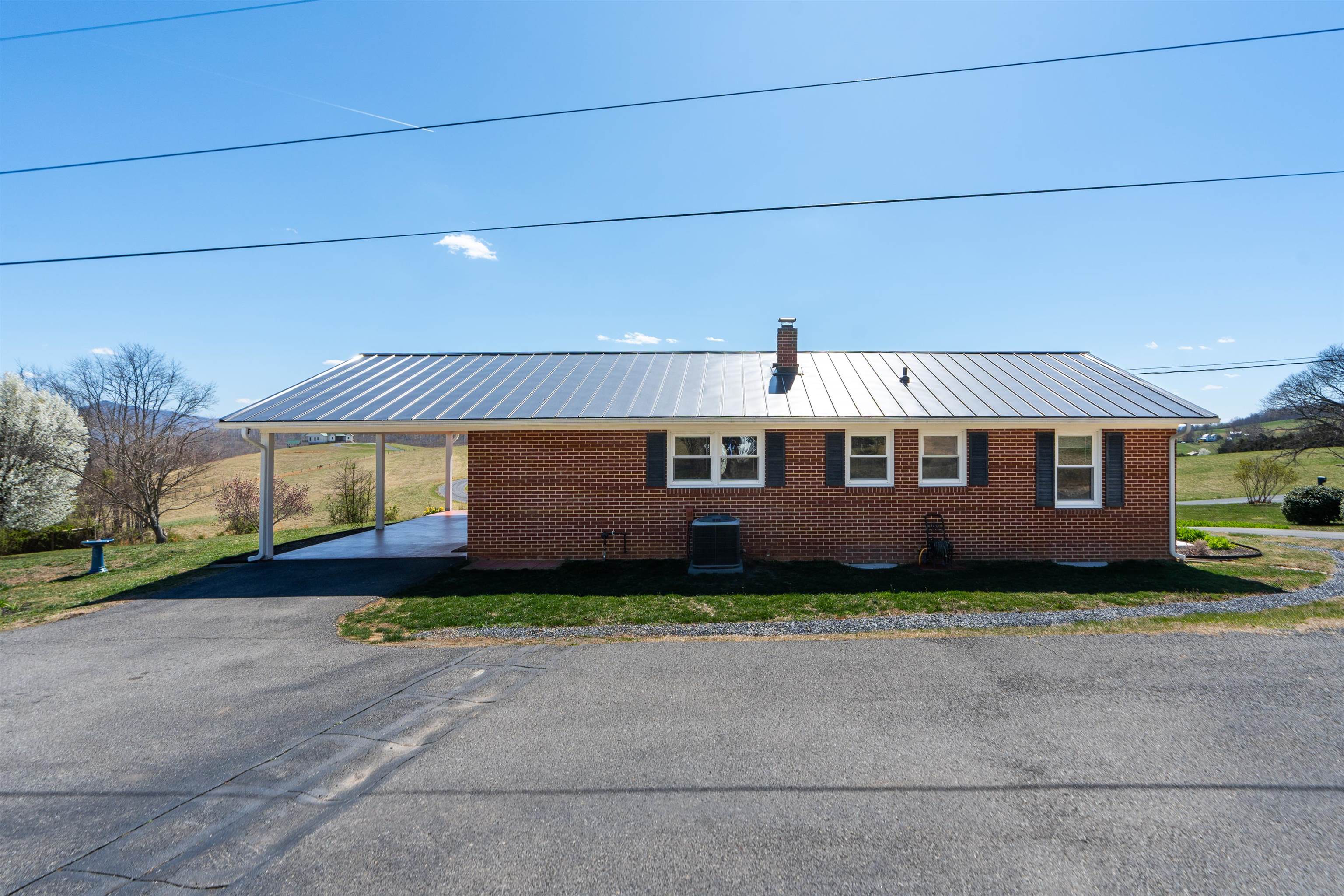 899 Timber Ridge Road Fairfield, VA 24435 - Photo 12 of 65 a front view of a house with a garden and yard