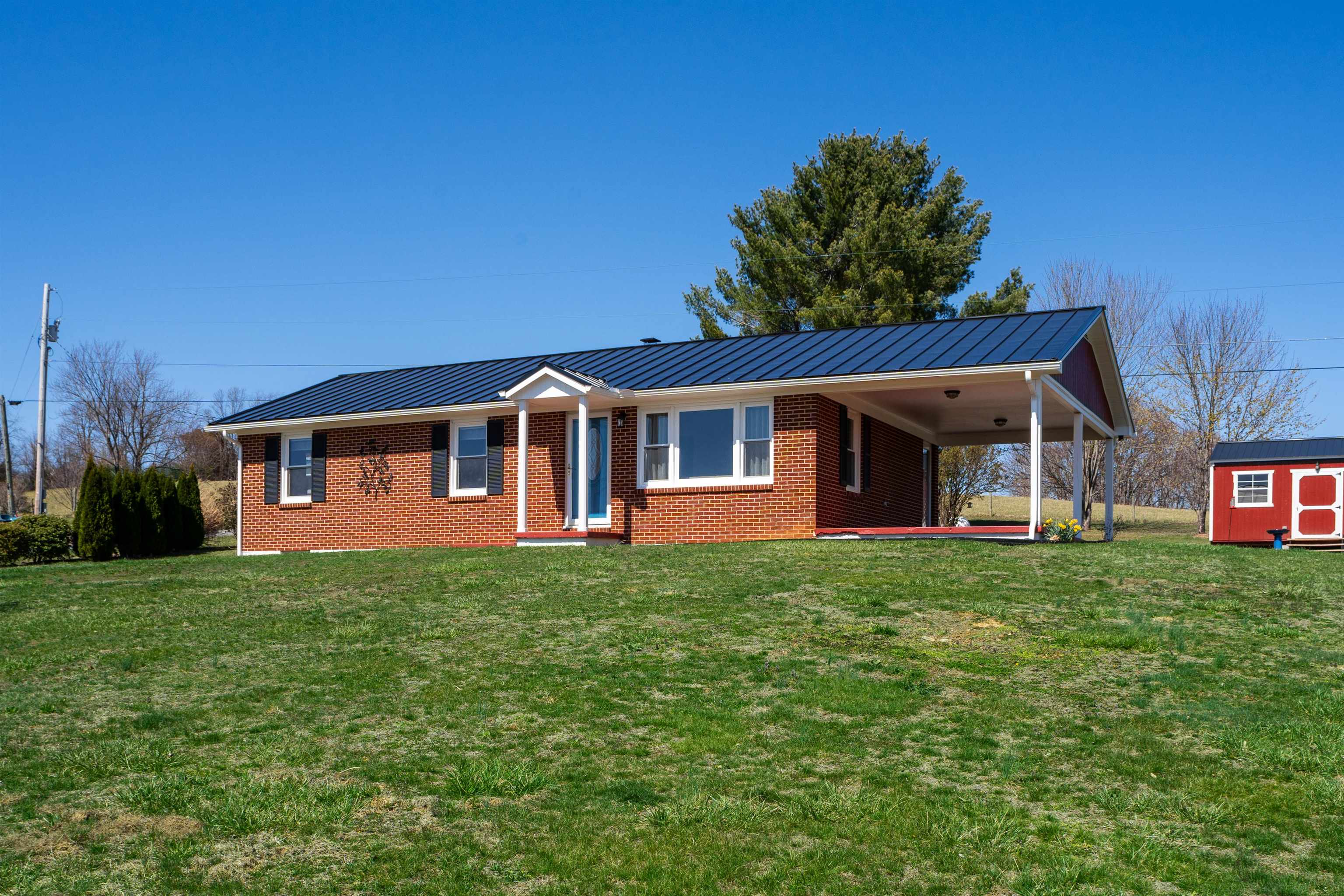899 Timber Ridge Road Fairfield, VA 24435 - Photo 2 of 65 a front view of a house with a yard and trees