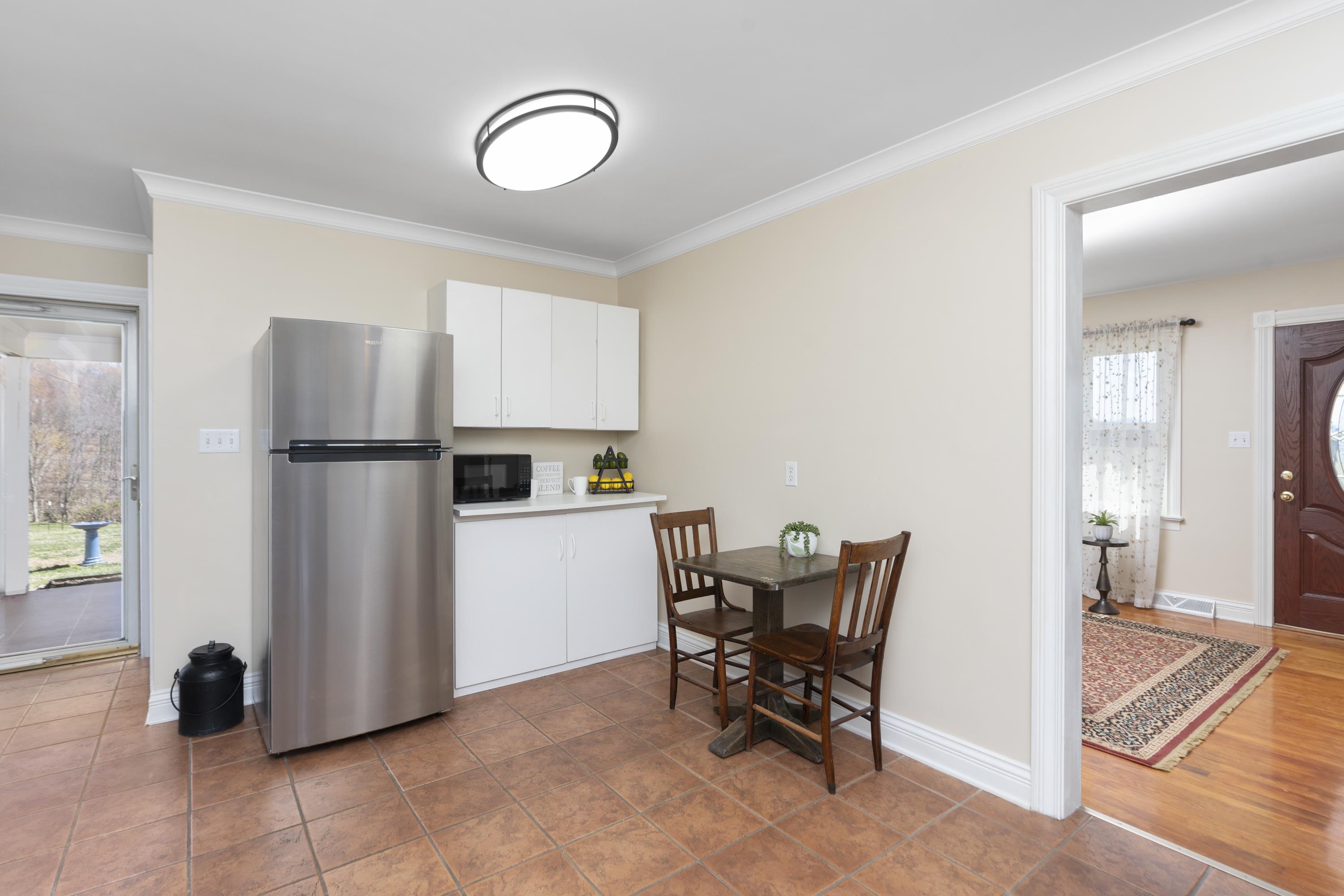 899 Timber Ridge Road Fairfield, VA 24435 - Photo 33 of 65 a view of kitchen with stainless steel appliances granite countertop dining table chairs and a refrigerator