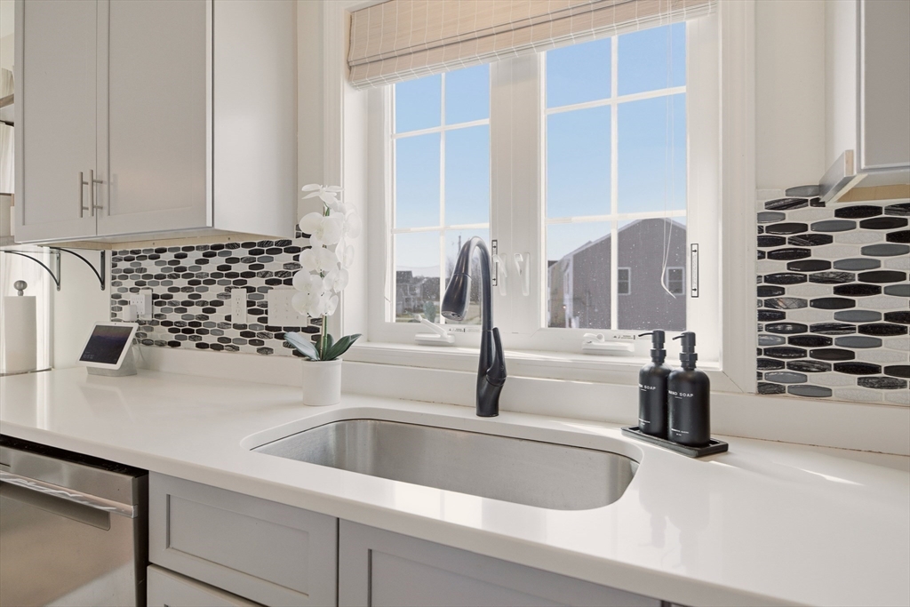 341 Courtney Street Fall River, MA 02720 - Photo 14 of 39 a kitchen with a sink and a window