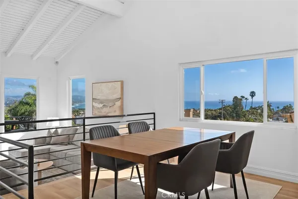 a view of a dining room with furniture and window
