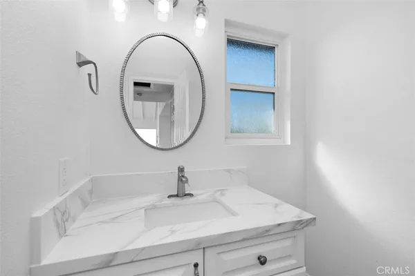 a close view of a sink and a mirror in a bathroom