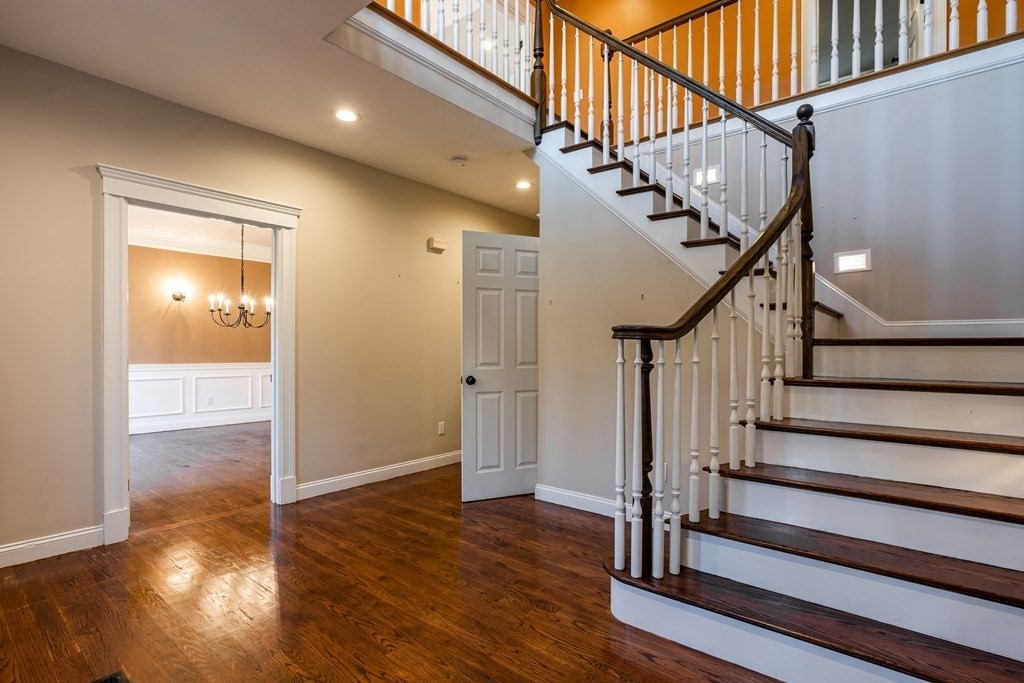 50 Corn Road Bolton, MA 01740 - Photo 17 of 40 a view of staircase with wooden floor and white walls