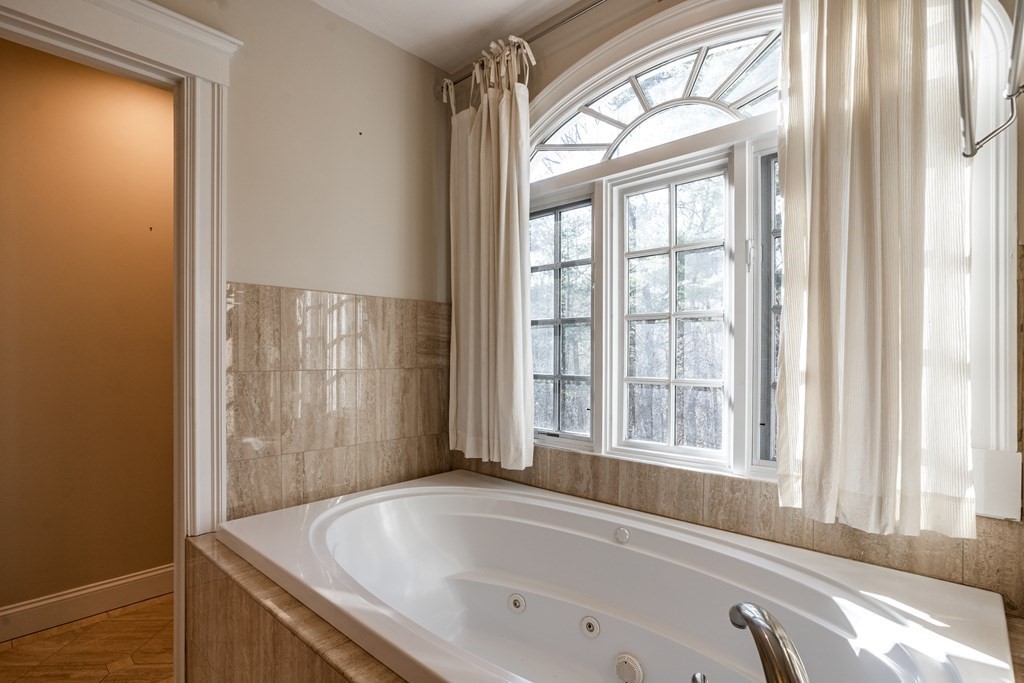50 Corn Road Bolton, MA 01740 - Photo 22 of 40 a bathroom with bathtub and window