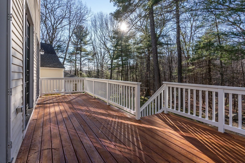 50 Corn Road Bolton, MA 01740 - Photo 38 of 40 a view of backyard with deck and wooden floor