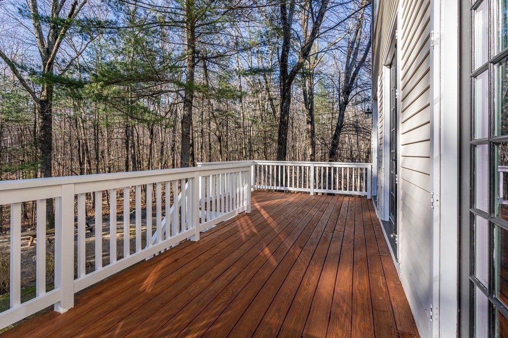 50 Corn Road Bolton, MA 01740 - Photo 39 of 40 a view of balcony with wooden floor and fence