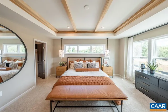 a bedroom with a large bed and a large window