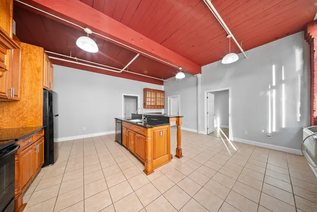 a kitchen with stainless steel appliances granite countertop a sink and cabinets