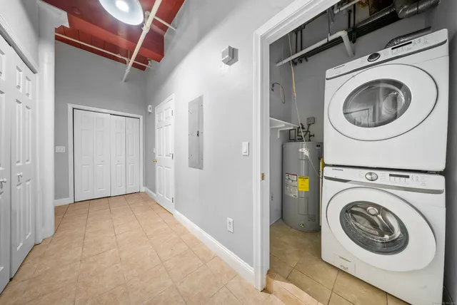 a view of a hallway with washer and dryer