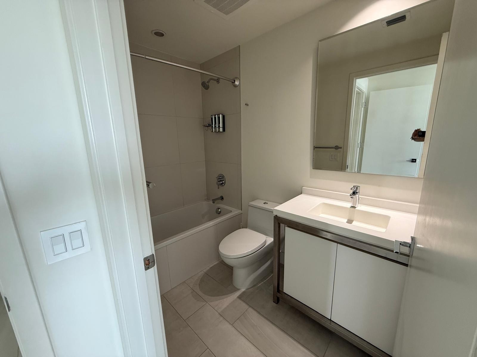 2000 Metropica Way, Unit 1109 Sunrise, FL 33323 - Photo 12 of 34 a bathroom with a granite countertop sink toilet and shower