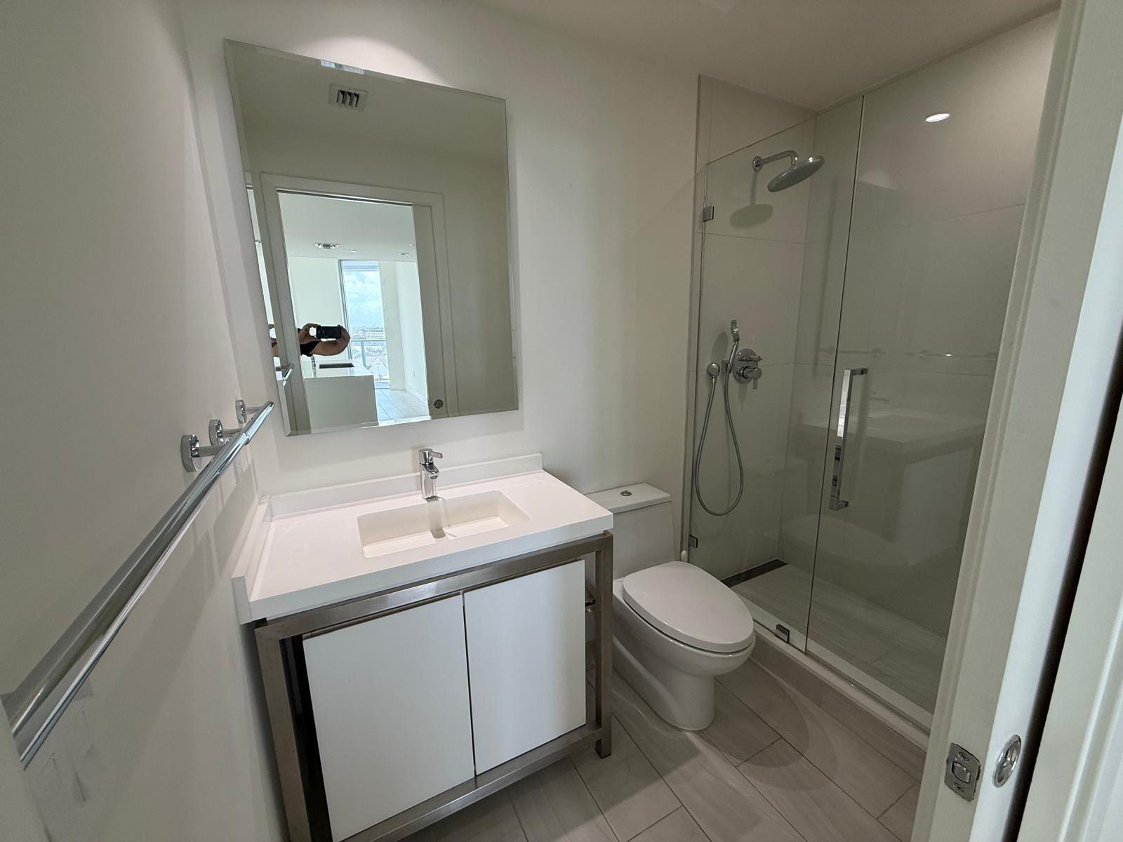 2000 Metropica Way, Unit 1109 Sunrise, FL 33323 - Photo 14 of 34 a bathroom with a toilet sink and shower