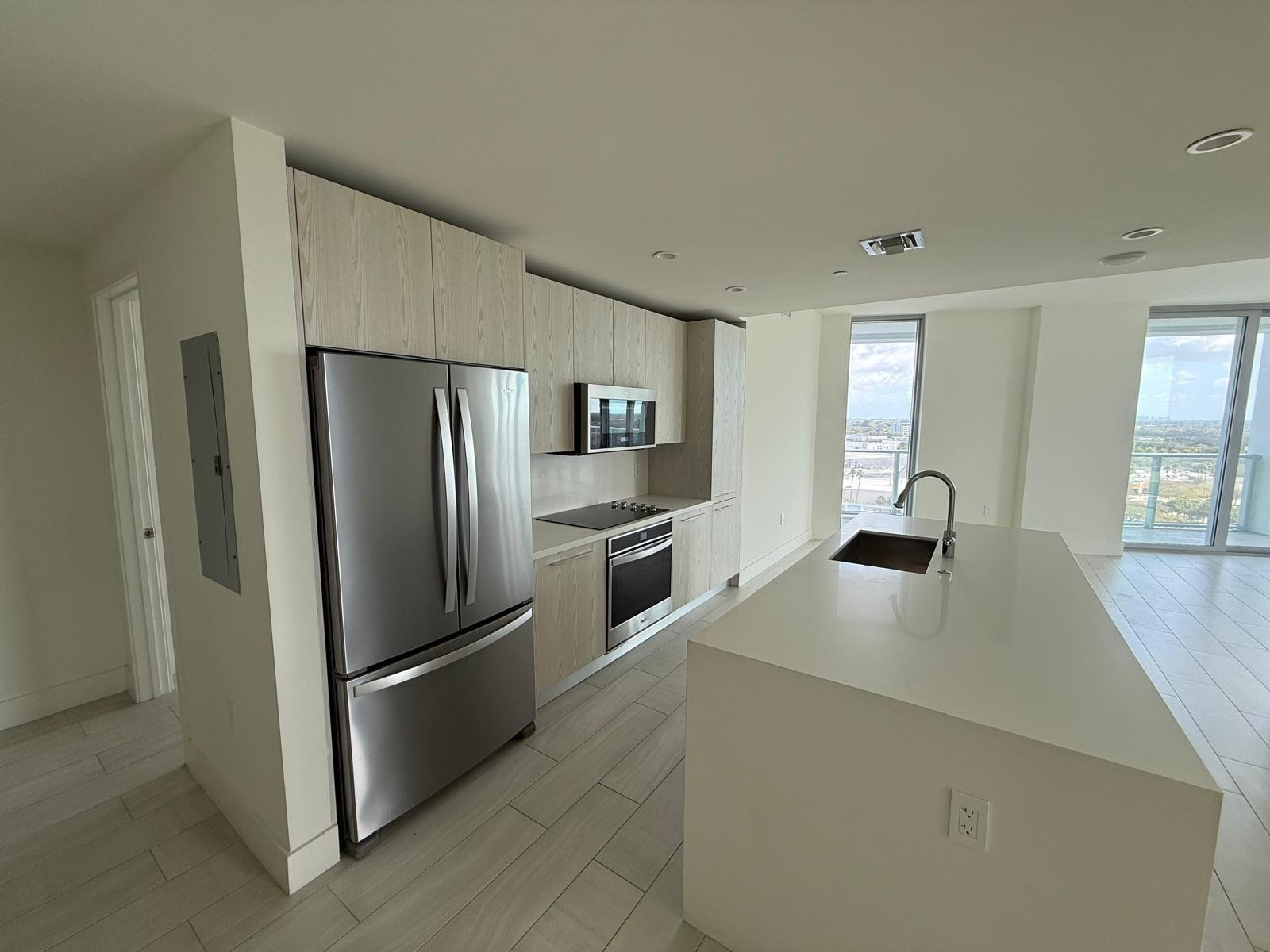 2000 Metropica Way, Unit 1109 Sunrise, FL 33323 - Photo 2 of 34 a kitchen with stainless steel appliances a refrigerator and a stove