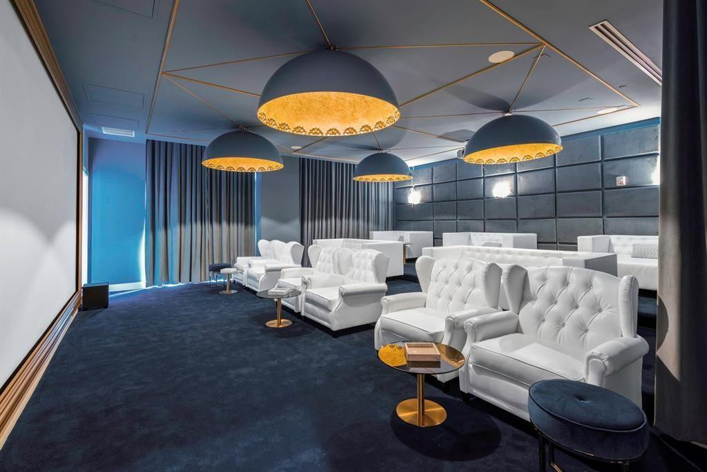 2000 Metropica Way, Unit 1109 Sunrise, FL 33323 - Photo 29 of 34 a living room with furniture and a fireplace