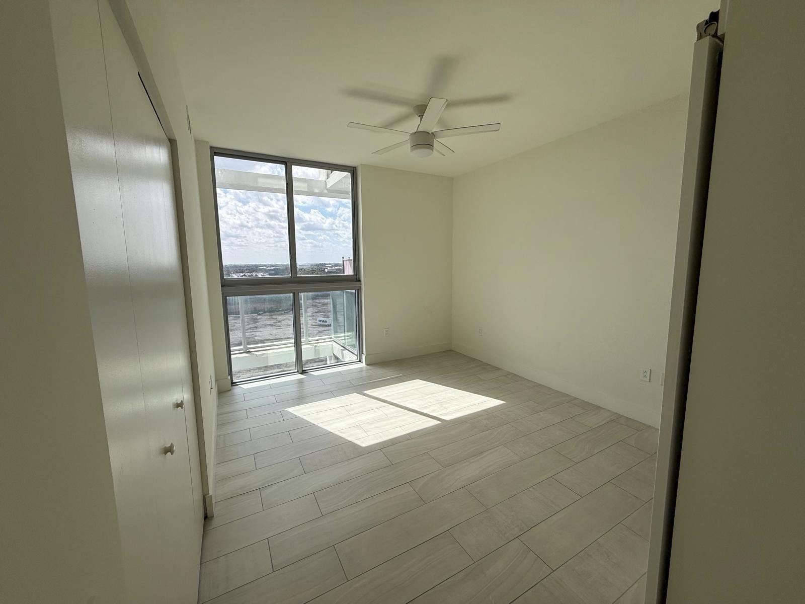 2000 Metropica Way, Unit 1109 Sunrise, FL 33323 - Photo 4 of 34 a view of an empty room with a window