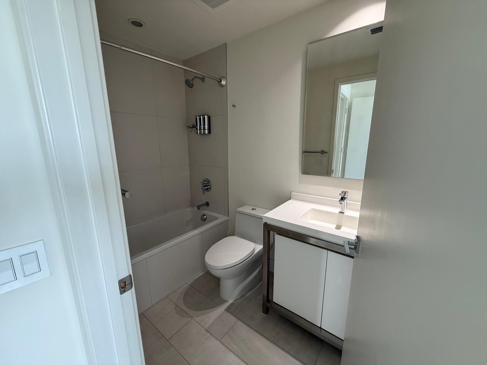 2000 Metropica Way, Unit 1109 Sunrise, FL 33323 - Photo 5 of 34 a bathroom with a sink toilet and shower