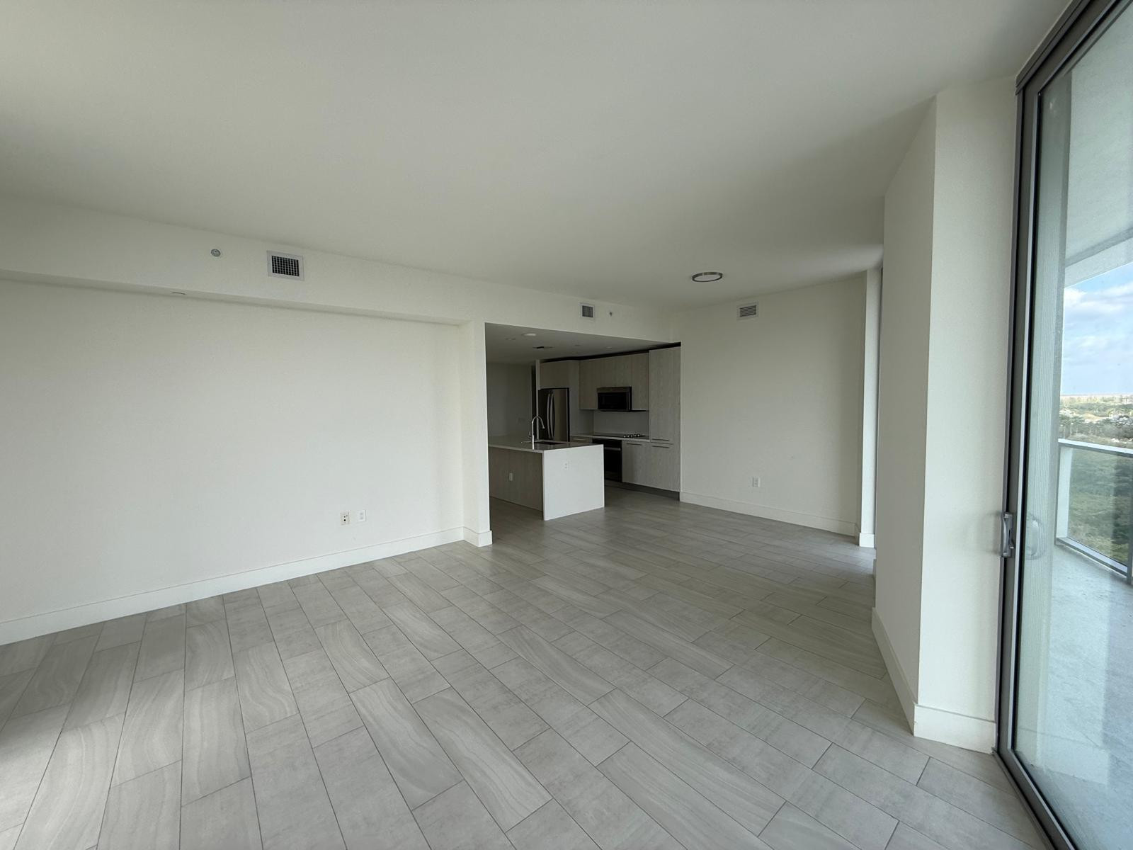 2000 Metropica Way, Unit 1109 Sunrise, FL 33323 - Photo 6 of 34 a view of empty room with wooden floor