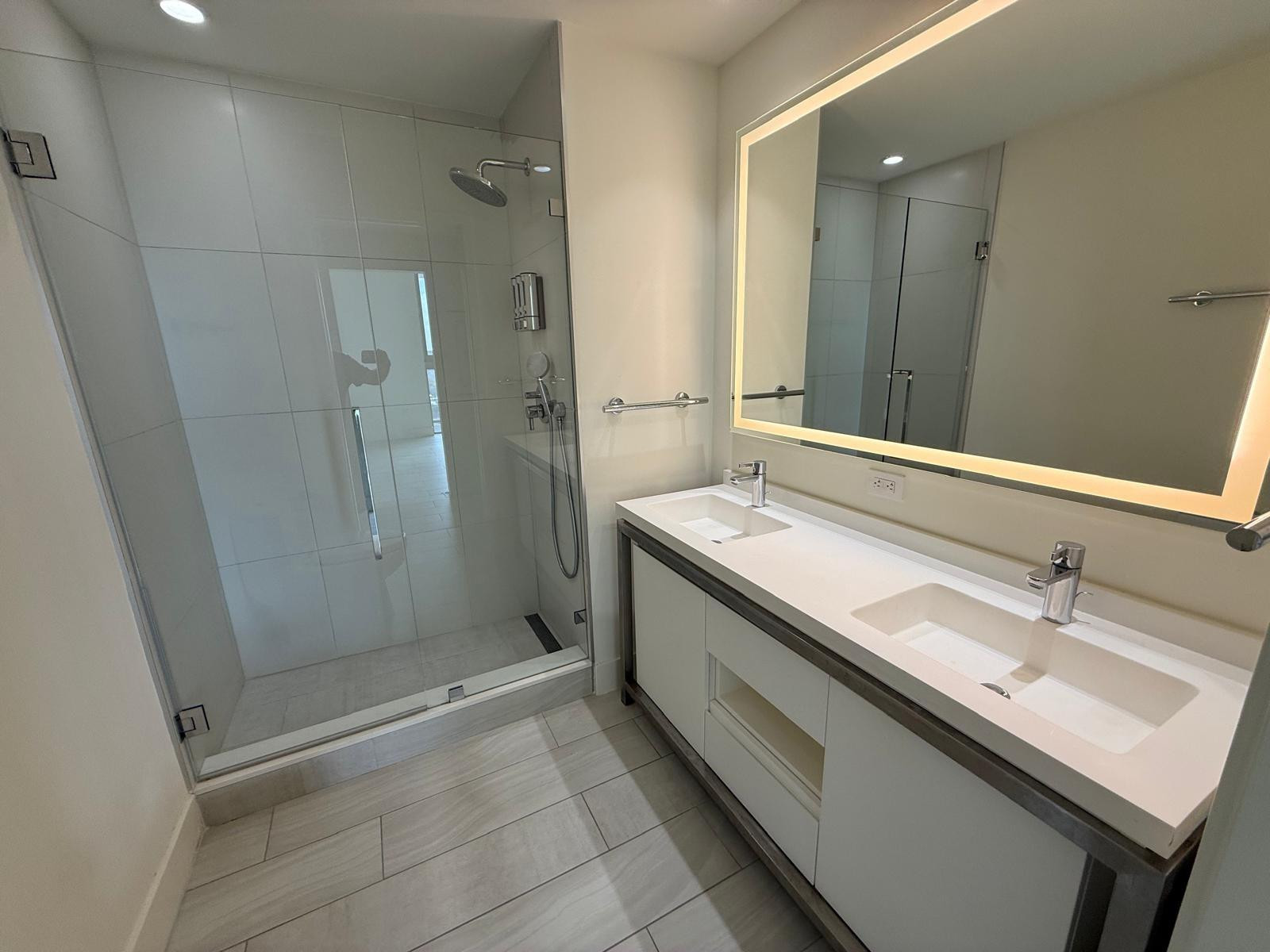 2000 Metropica Way, Unit 1109 Sunrise, FL 33323 - Photo 8 of 34 a bathroom with a double vanity sink a and mirror