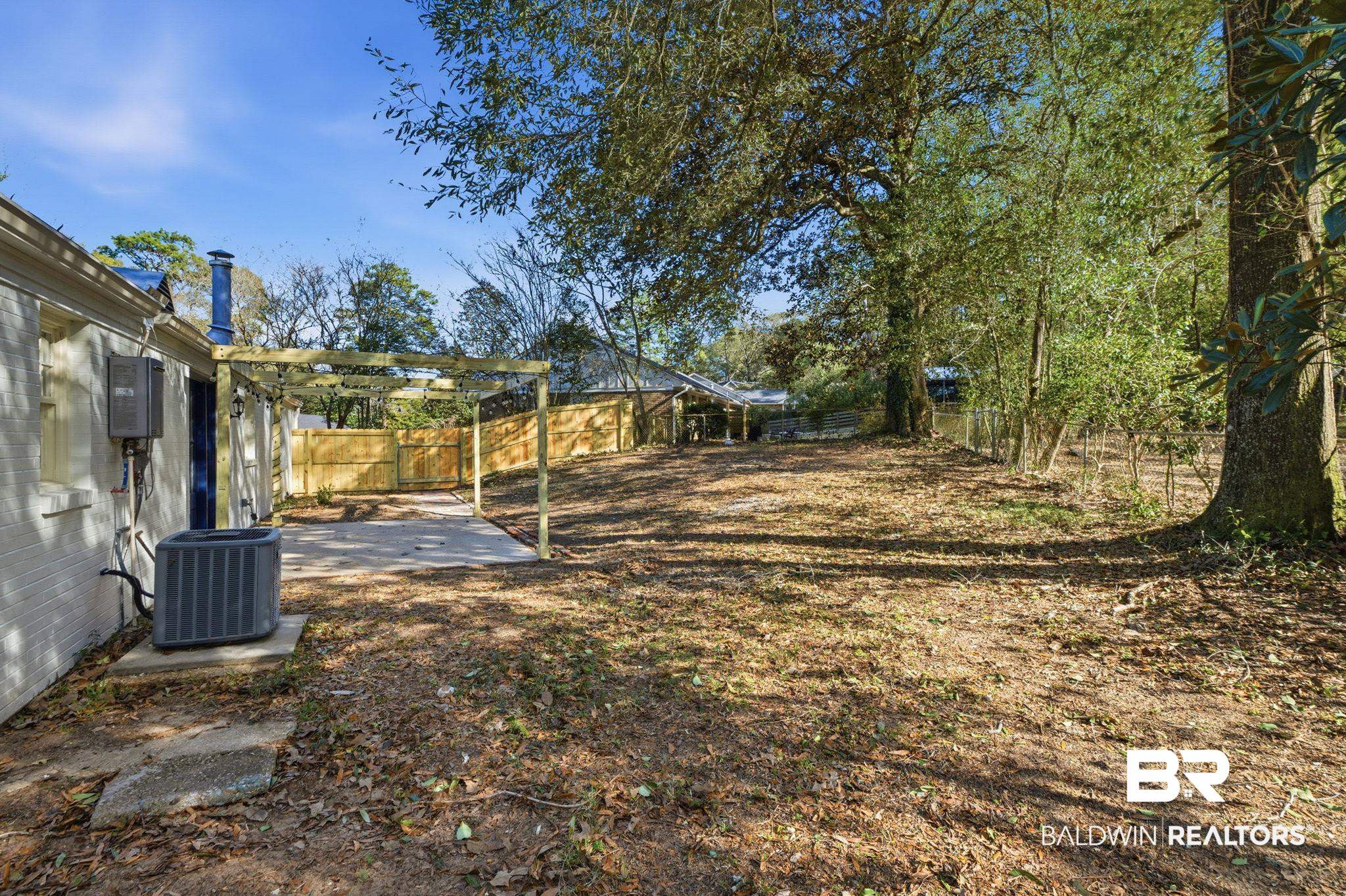 814 Nassau Drive Mobile, AL 36608 - Photo 36 of 44 Fenced backyard featuring a patio area and a pergola