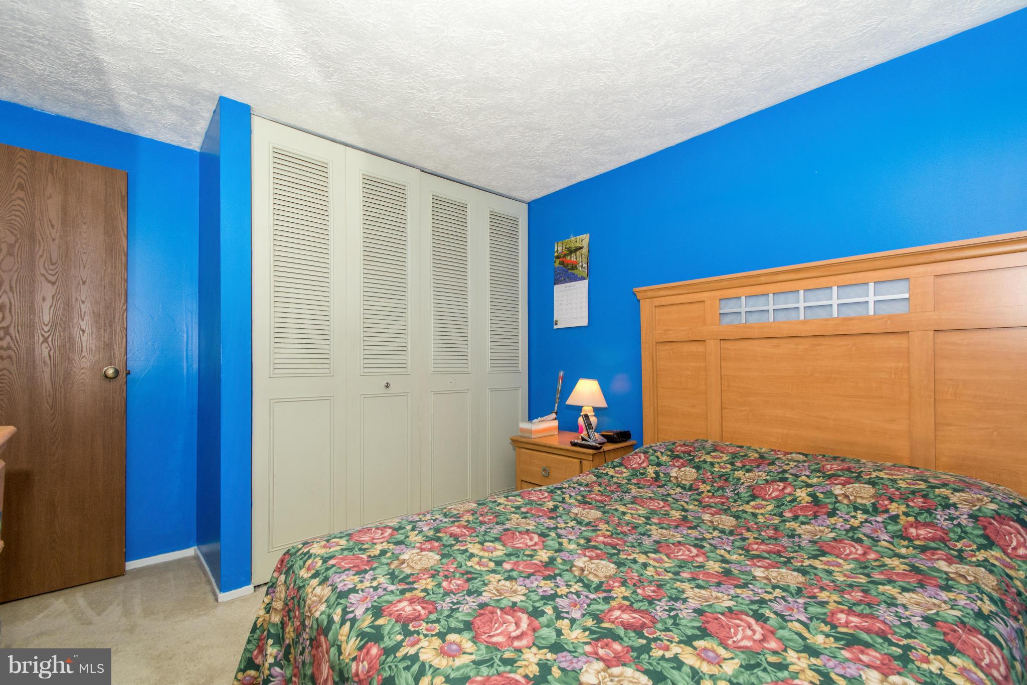 4825 Hawksbury Road Baltimore, MD 21208 - Photo 17 of 29 a bedroom with bed and a window