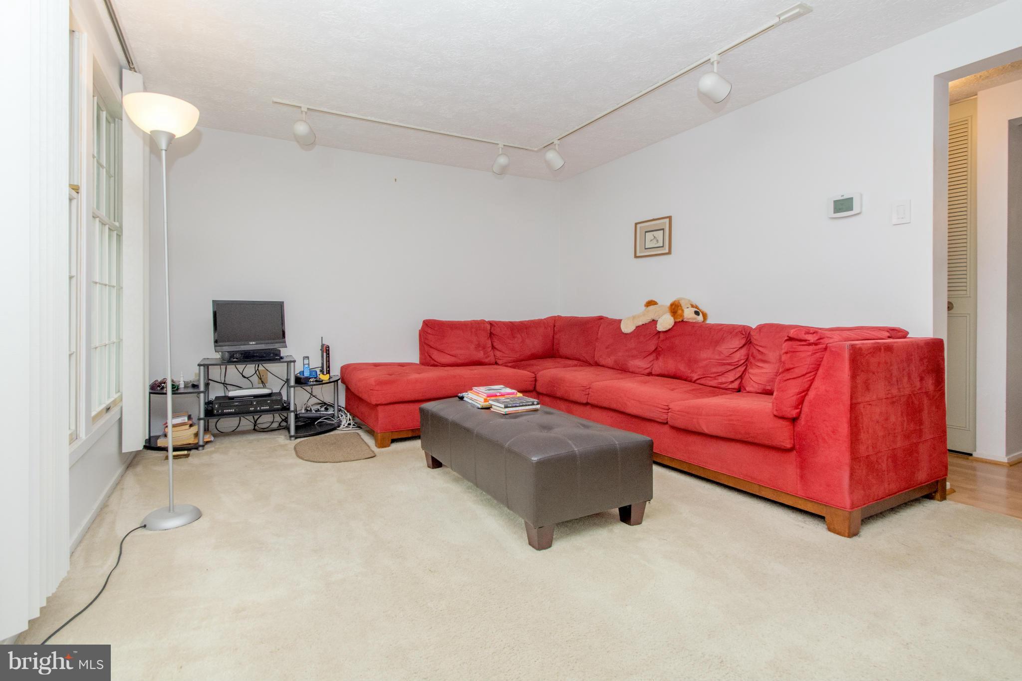 4825 Hawksbury Road Baltimore, MD 21208 - Photo 3 of 29 a living room with furniture and a couch