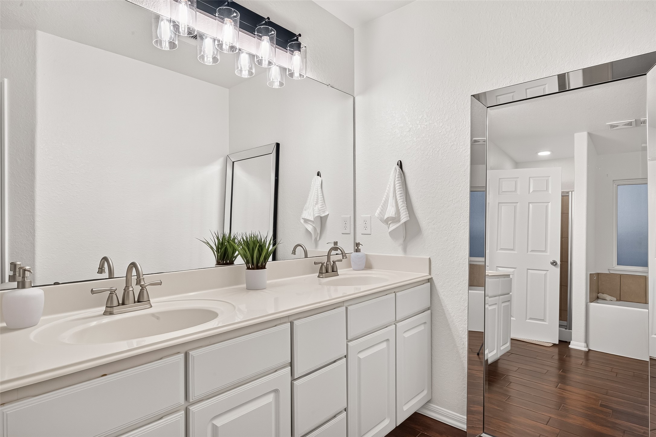 3155 View Valley Trail Katy, TX 77493 - Photo 34 of 50 "Bright primary bathroom vanity with generous counter space, sleek hardware, and modern lighting