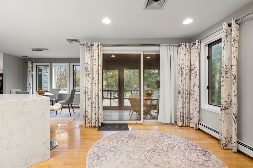 7 Par Brae Grantham, NH 03753 - Photo 14 of 42 a view of a big room with wooden floor and windows