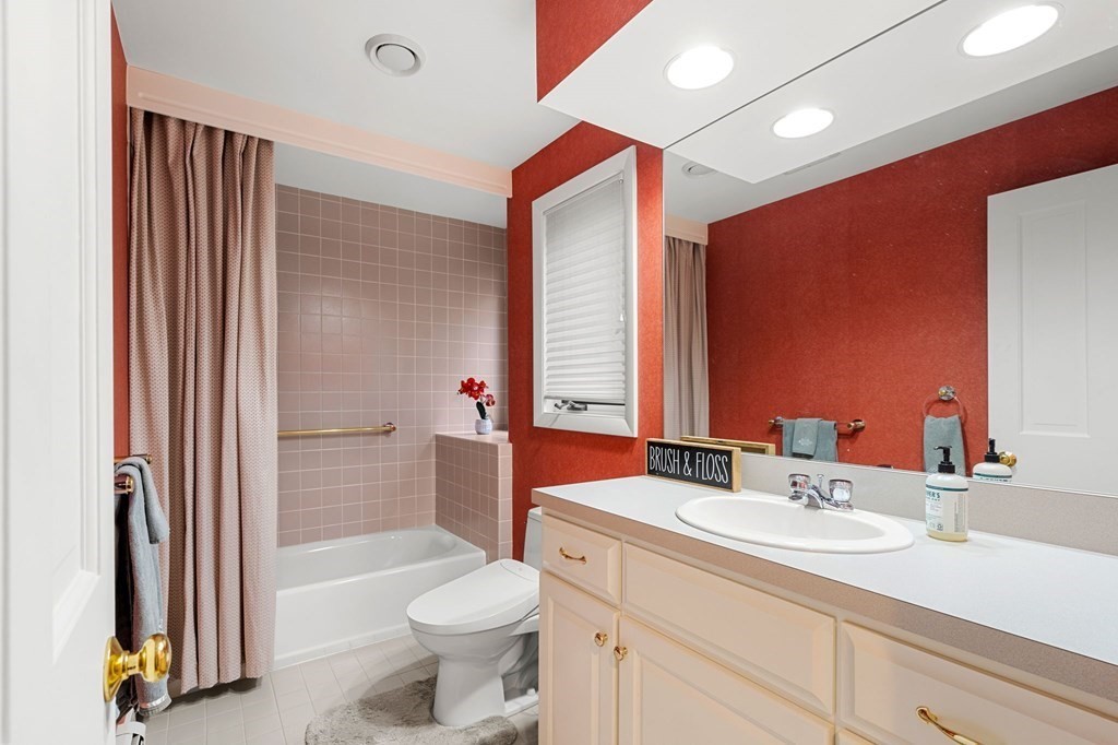 7 Par Brae Grantham, NH 03753 - Photo 18 of 42 a bathroom with a sink a toilet and a large mirror